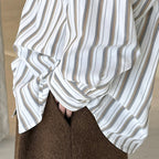 Striped long sleeved loose silhouette slimming shirt top