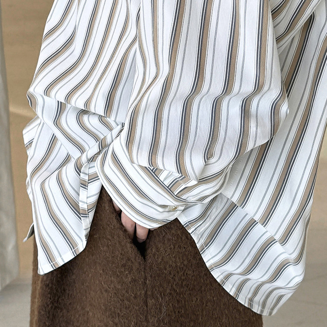 Striped long sleeved loose silhouette slimming shirt top
