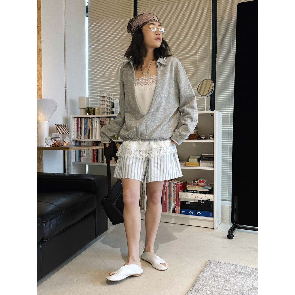 Oversized V-neck pullover sweatshirt with raw edge collar and relaxed fit