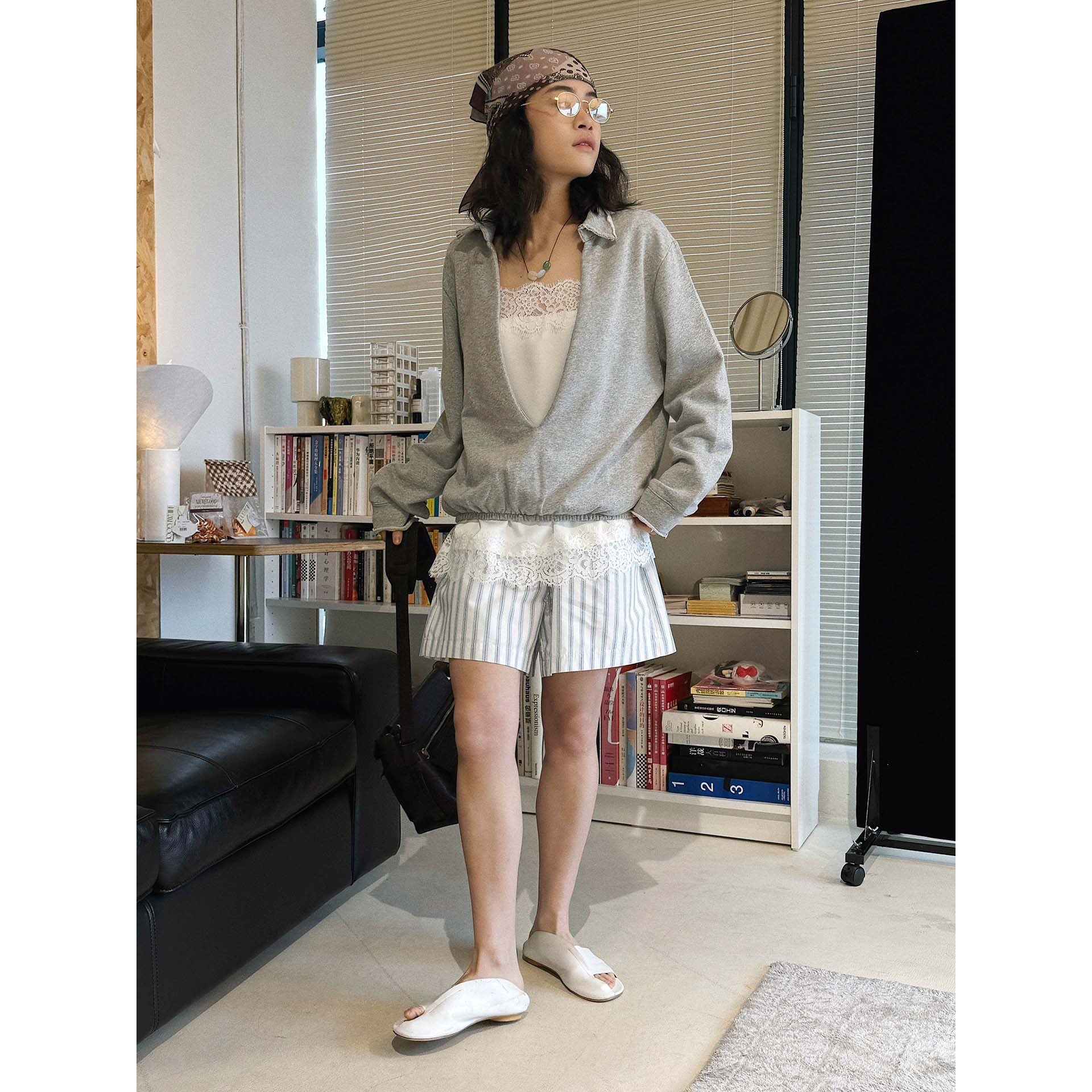 Oversized V-neck pullover sweatshirt with raw edge collar and relaxed fit