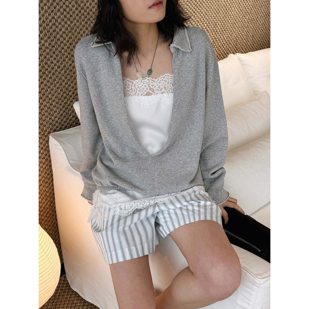 Oversized V-neck pullover sweatshirt with raw edge collar and relaxed fit