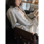 Oversized V-neck pullover sweatshirt with raw edge collar and relaxed fit