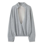 Oversized V-neck pullover sweatshirt with raw edge collar and relaxed fit