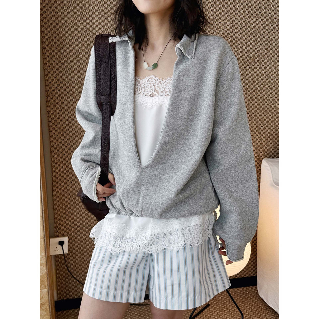 Oversized V-neck pullover sweatshirt with raw edge collar and relaxed fit