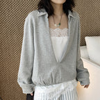 Oversized V-neck pullover sweatshirt with raw edge collar and relaxed fit