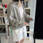 Oversized V-neck pullover sweatshirt with raw edge collar and relaxed fit