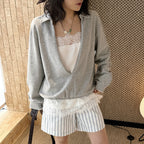 Oversized V-neck pullover sweatshirt with raw edge collar and relaxed fit