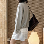 Oversized V-neck pullover sweatshirt with raw edge collar and relaxed fit
