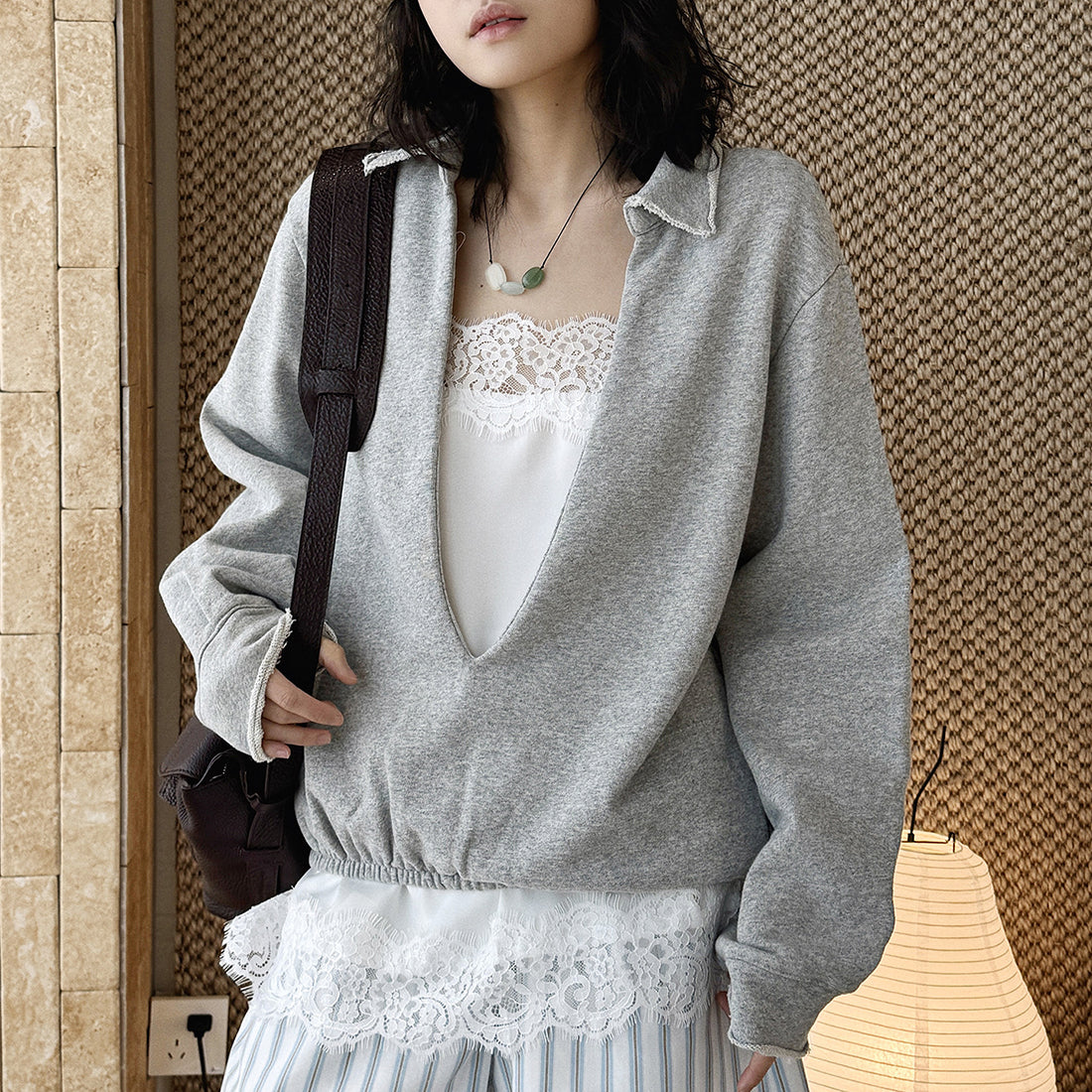Oversized V-neck pullover sweatshirt with raw edge collar and relaxed fit