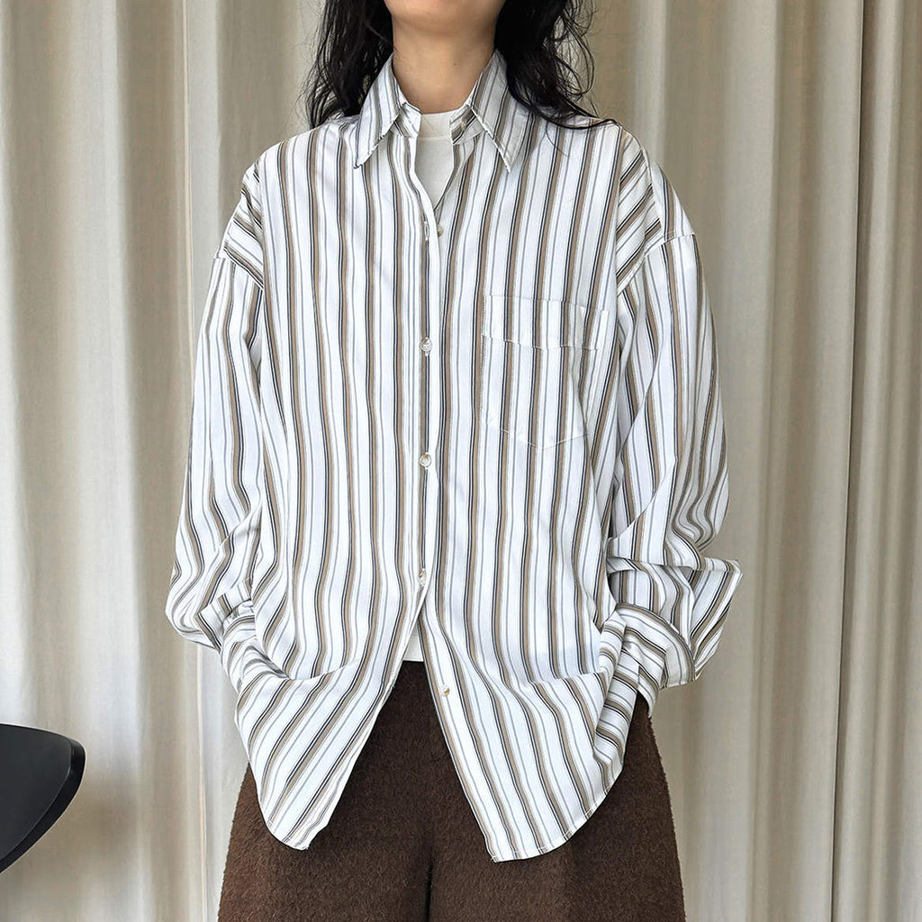 Striped long sleeved loose silhouette slimming shirt top