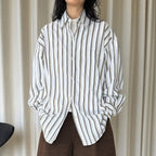 Striped long sleeved loose silhouette slimming shirt top