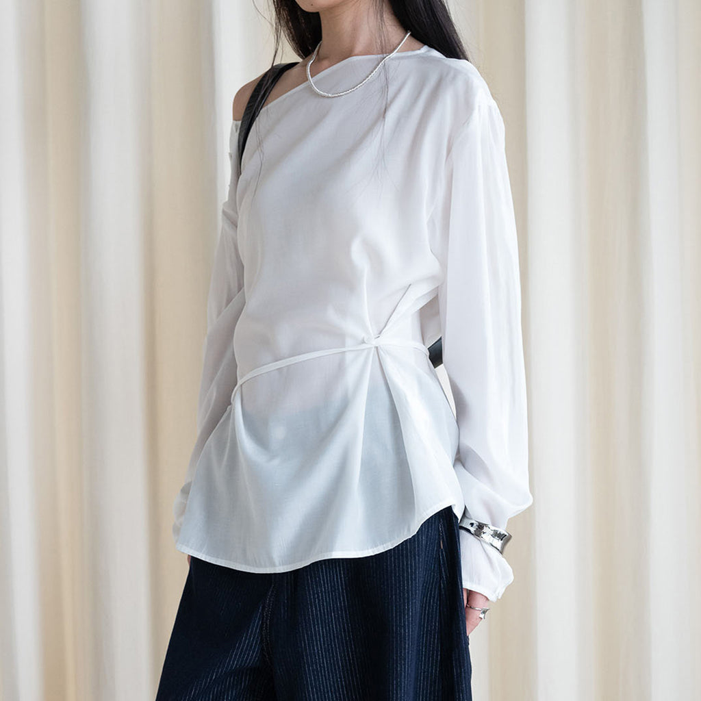 Asymmetric diagonal buckle strap waist cinching shirt top