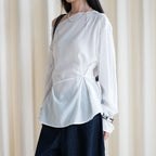Asymmetric diagonal buckle strap waist cinching shirt top