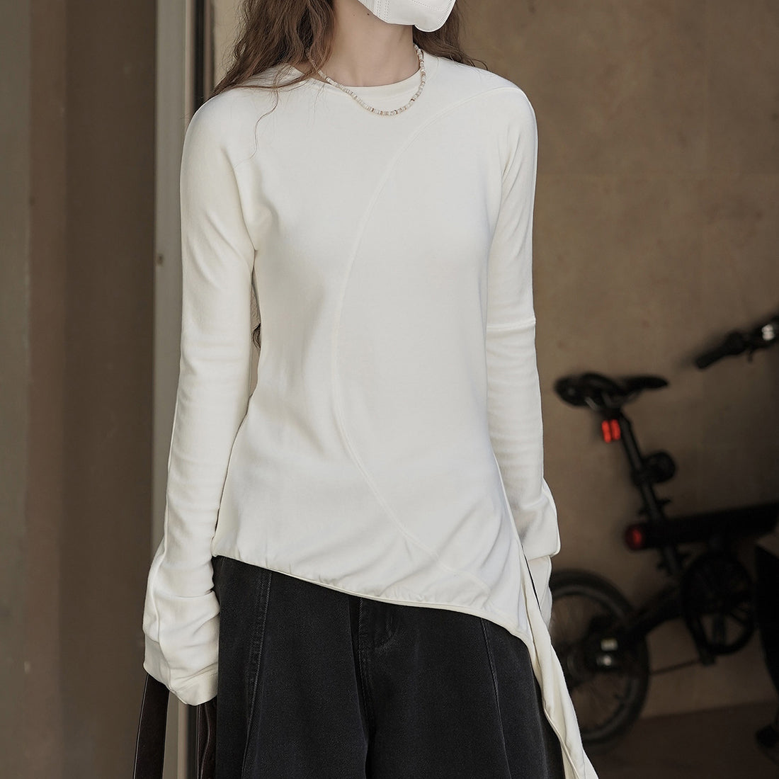 Asymmetric curved strap slim fit top