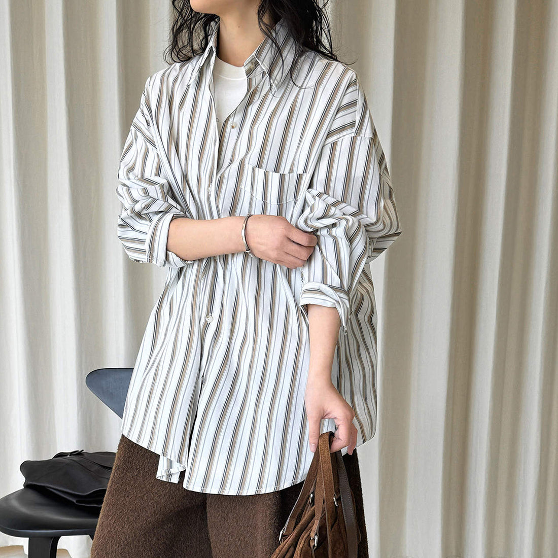 Striped long sleeved loose silhouette slimming shirt top