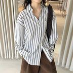 Striped long sleeved loose silhouette slimming shirt top