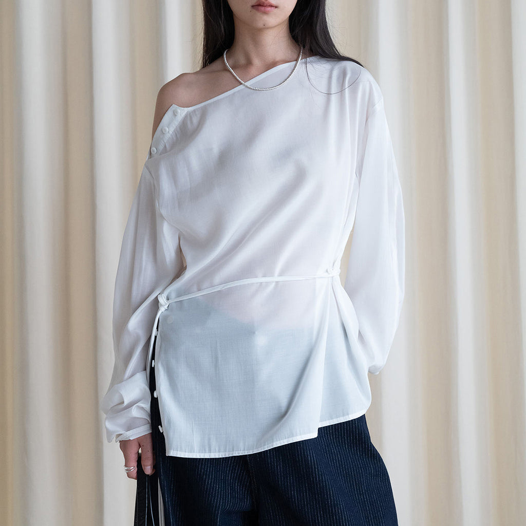 Asymmetric diagonal buckle strap waist cinching shirt top
