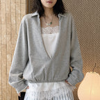 Oversized V-neck pullover sweatshirt with raw edge collar and relaxed fit