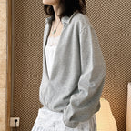 Oversized V-neck pullover sweatshirt with raw edge collar and relaxed fit