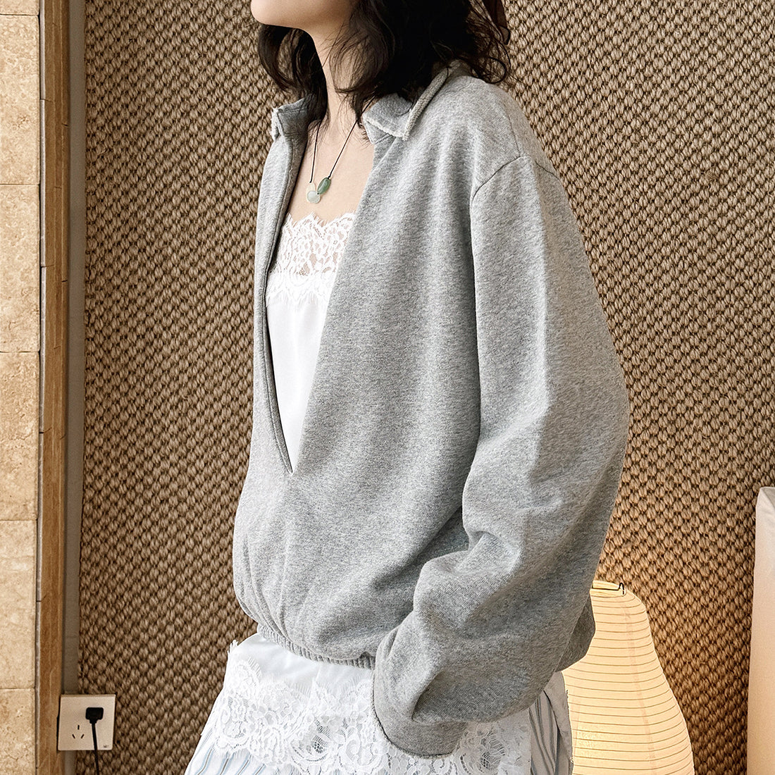 Oversized V-neck pullover sweatshirt with raw edge collar and relaxed fit