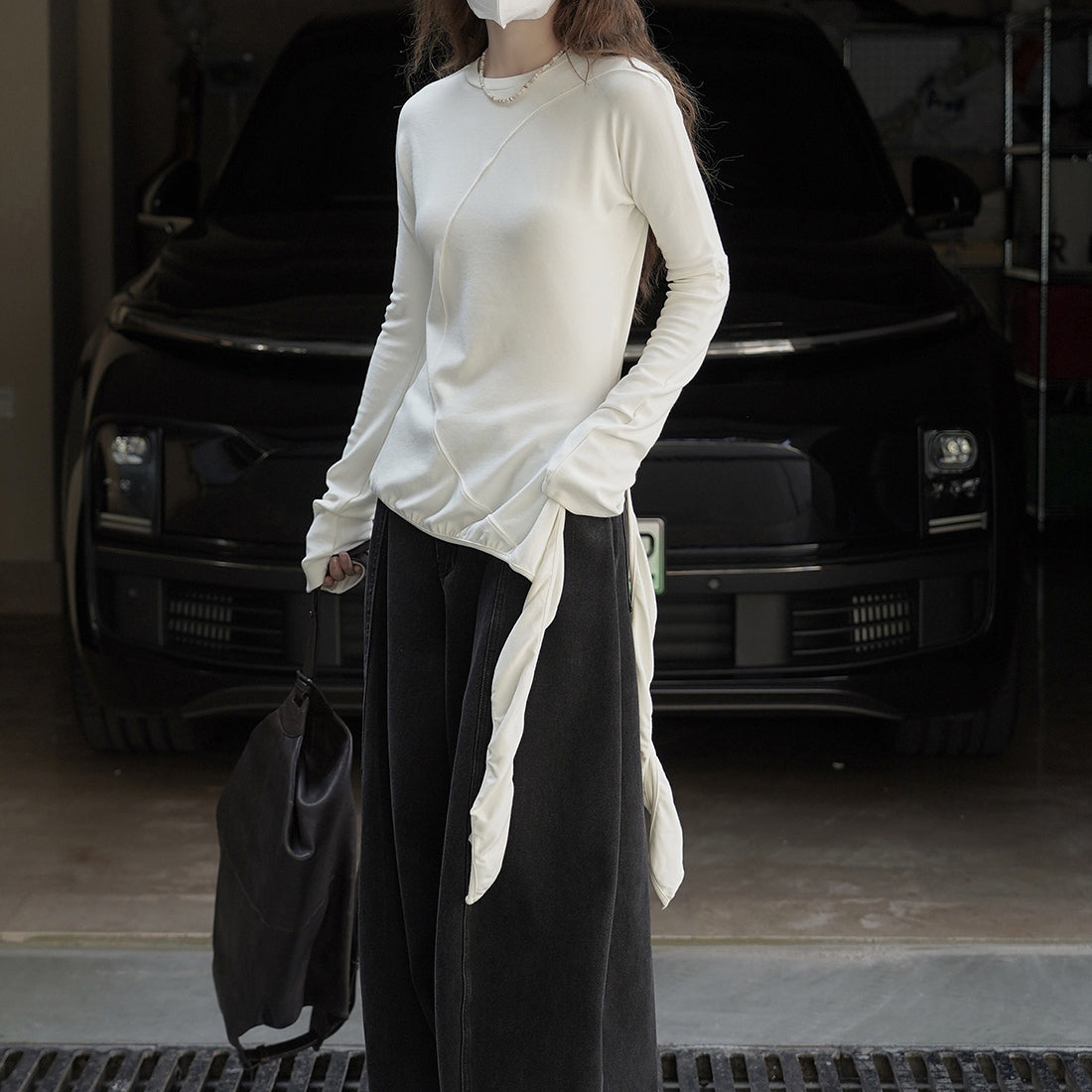 Asymmetric curved strap slim fit top