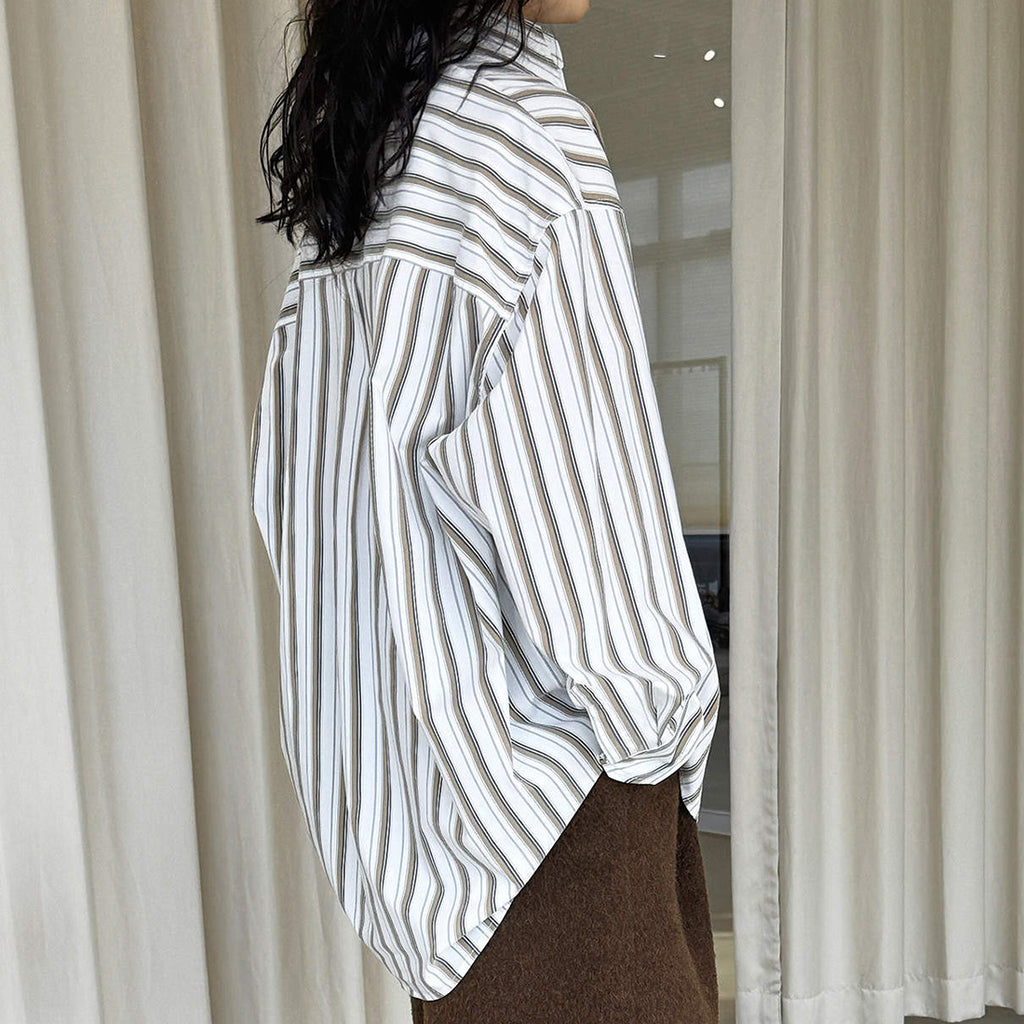 Striped long sleeved loose silhouette slimming shirt top