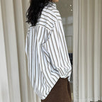 Striped long sleeved loose silhouette slimming shirt top
