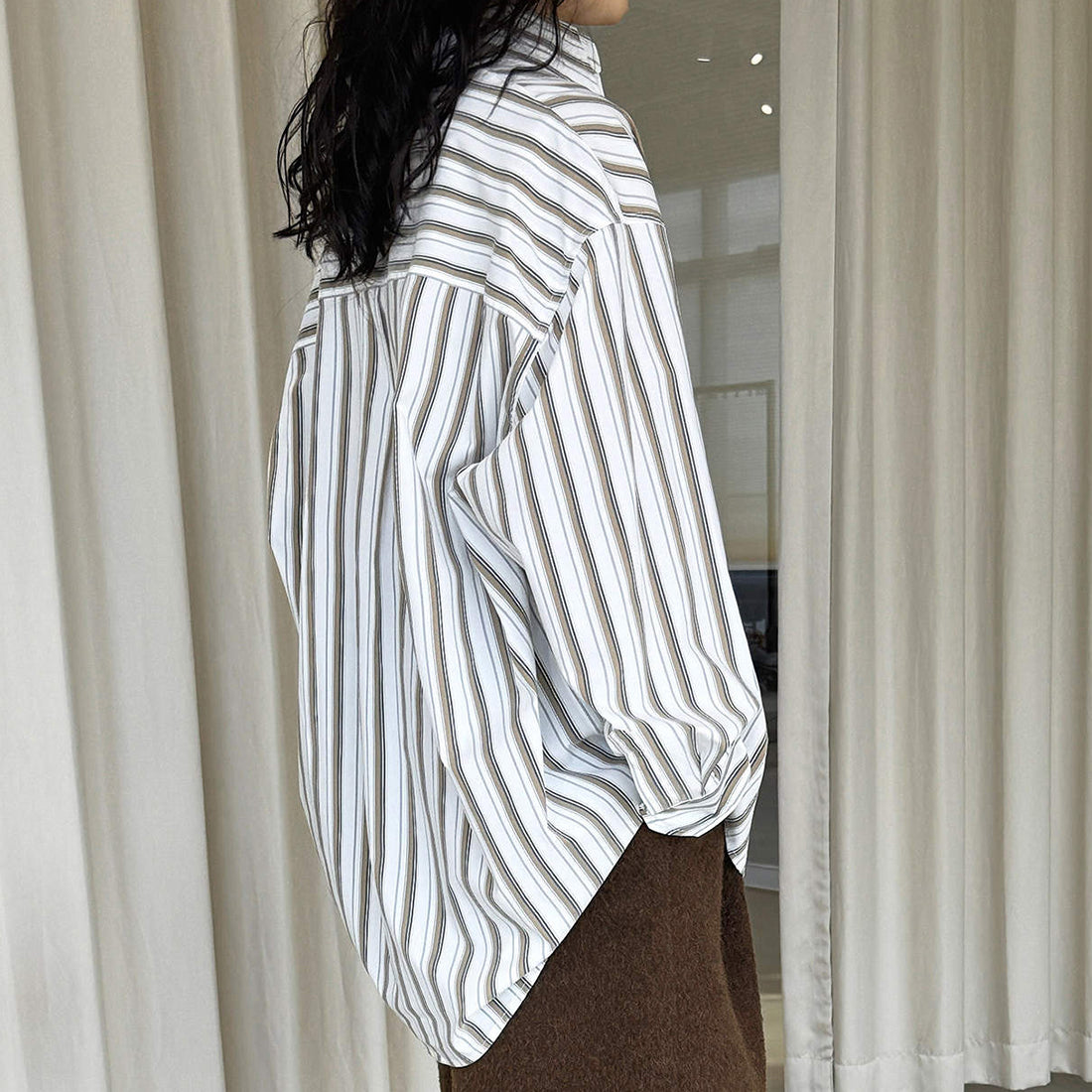 Striped long sleeved loose silhouette slimming shirt top