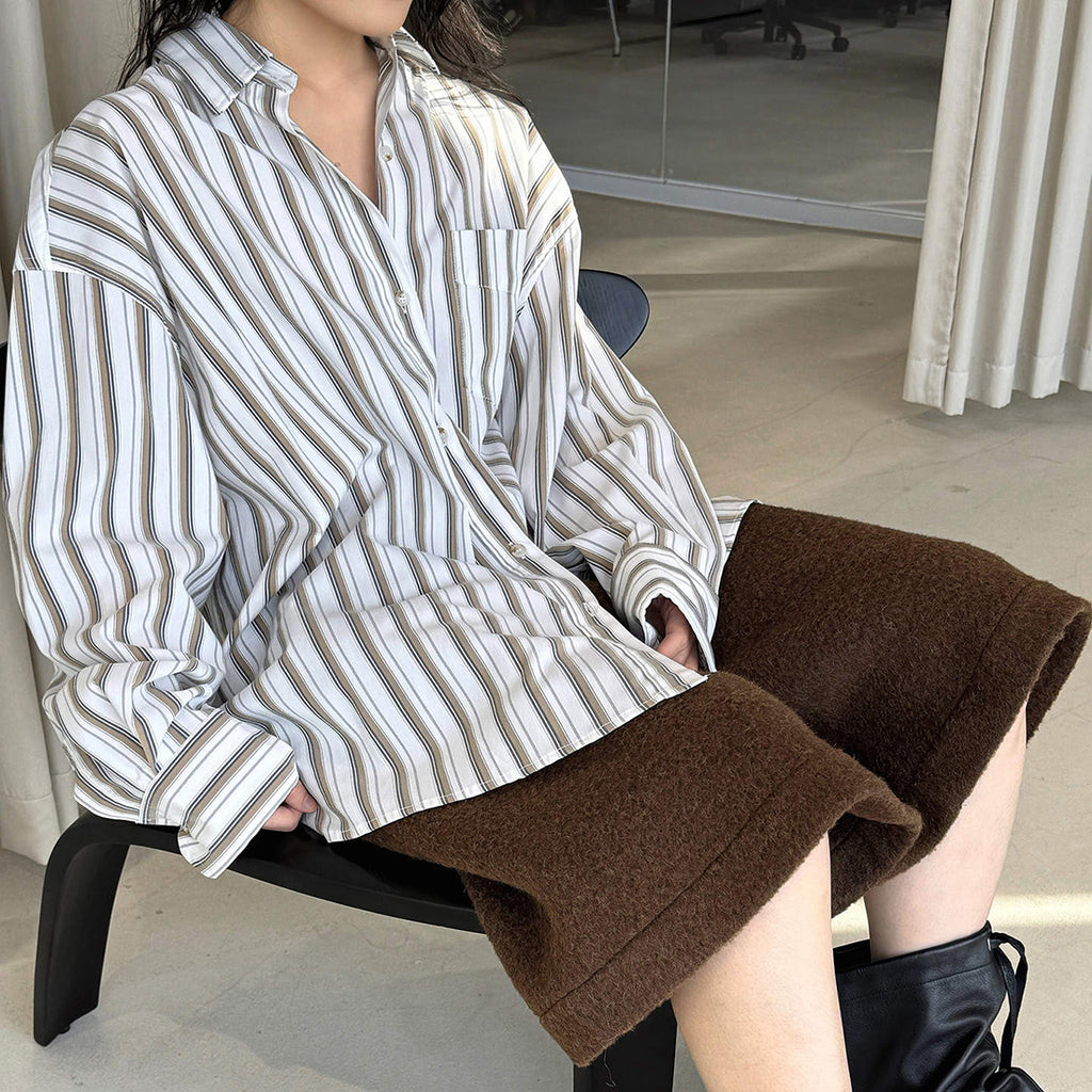 Striped long sleeved loose silhouette slimming shirt top