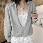 Oversized V-neck pullover sweatshirt with raw edge collar and relaxed fit