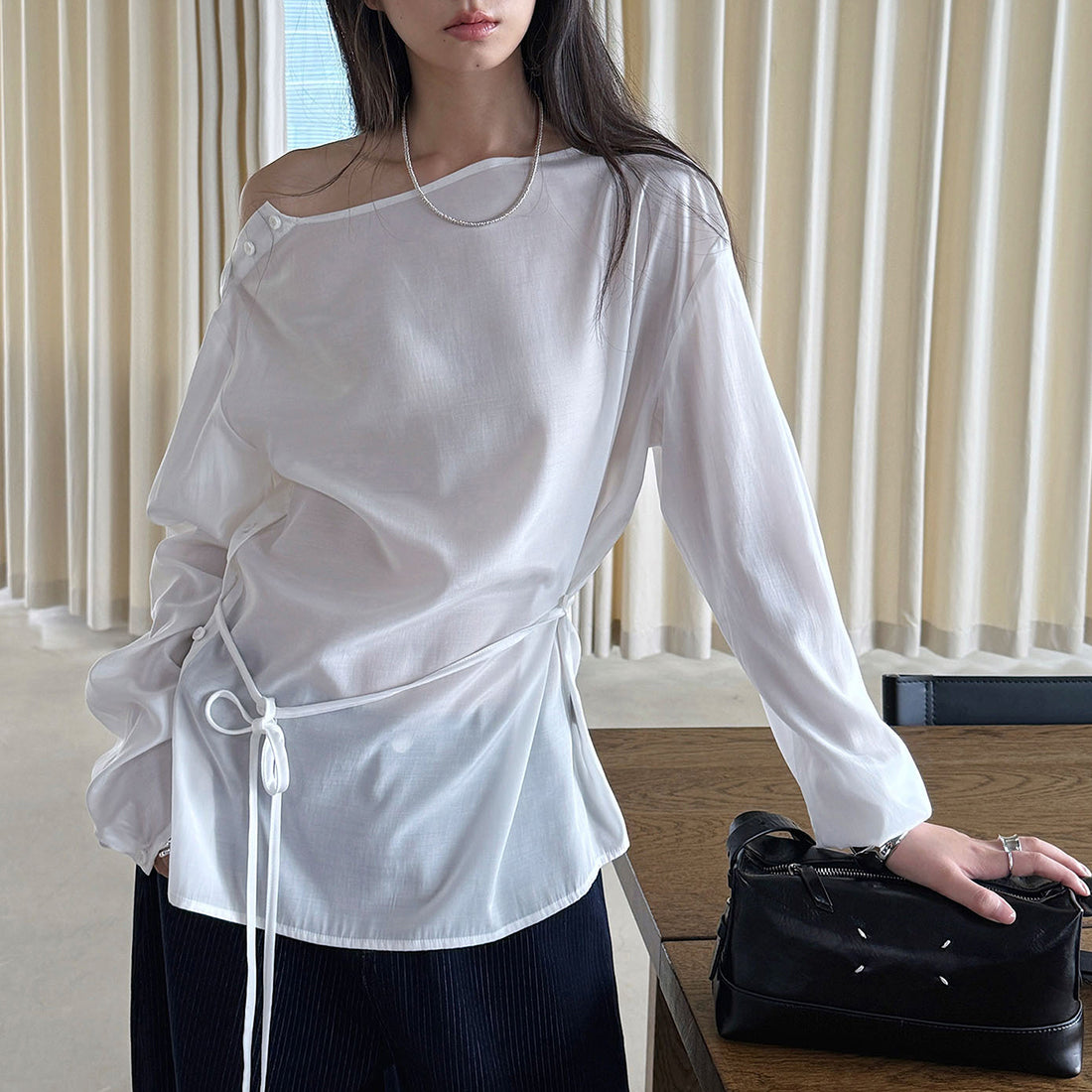 Asymmetric diagonal buckle strap waist cinching shirt top