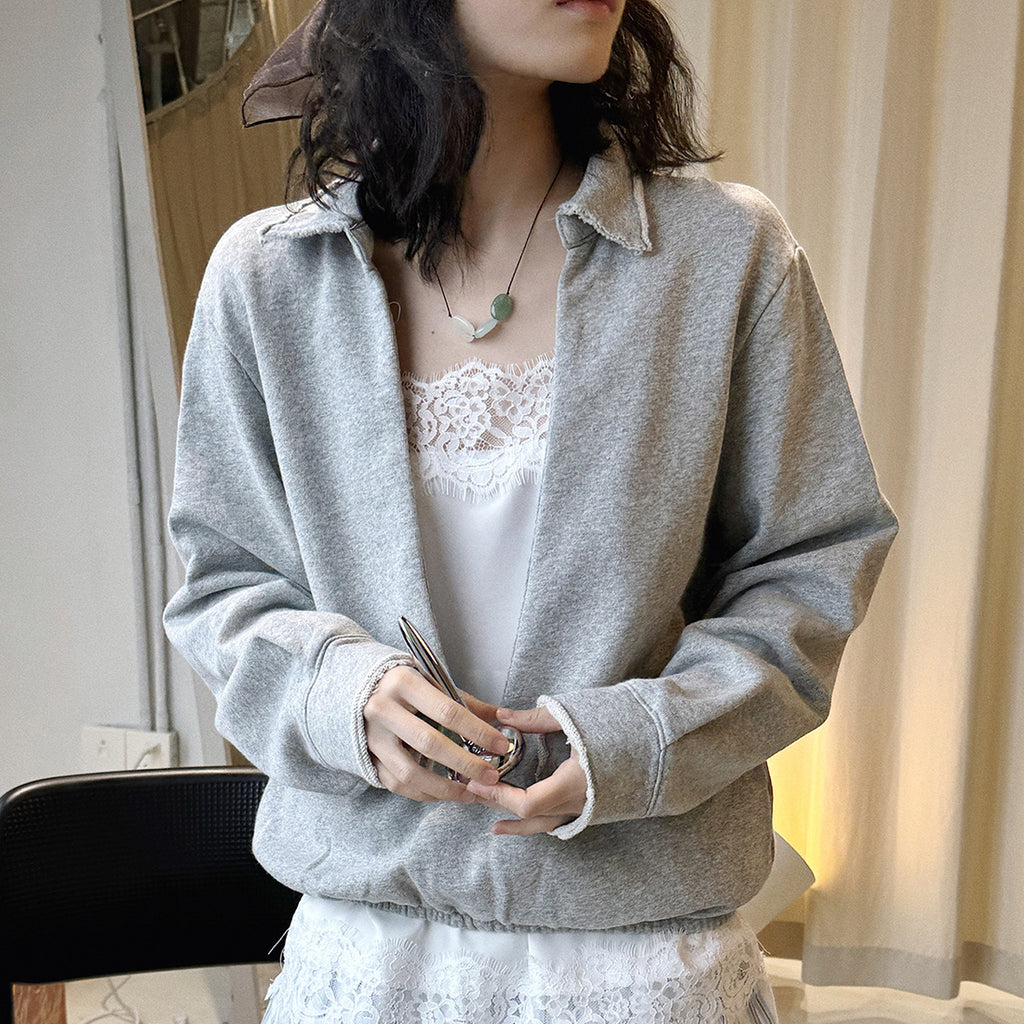 Oversized V-neck pullover sweatshirt with raw edge collar and relaxed fit