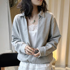 Oversized V-neck pullover sweatshirt with raw edge collar and relaxed fit