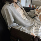 Oversized V-neck pullover sweatshirt with raw edge collar and relaxed fit