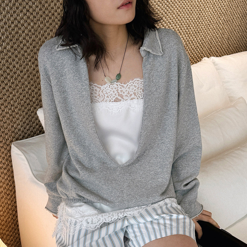 Oversized V-neck pullover sweatshirt with raw edge collar and relaxed fit