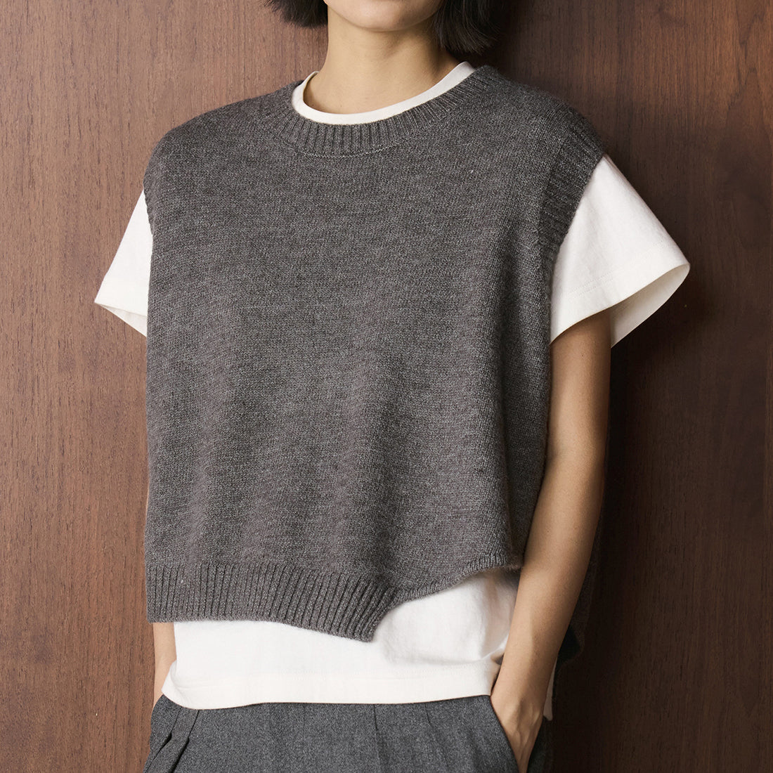 Asymmetric hem solid color round neck knitted vest top
