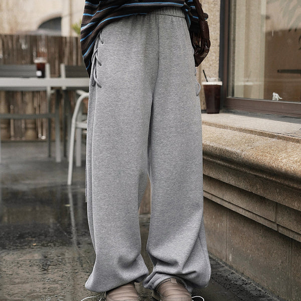 Elastic high waisted side straps and loose wide leg pants