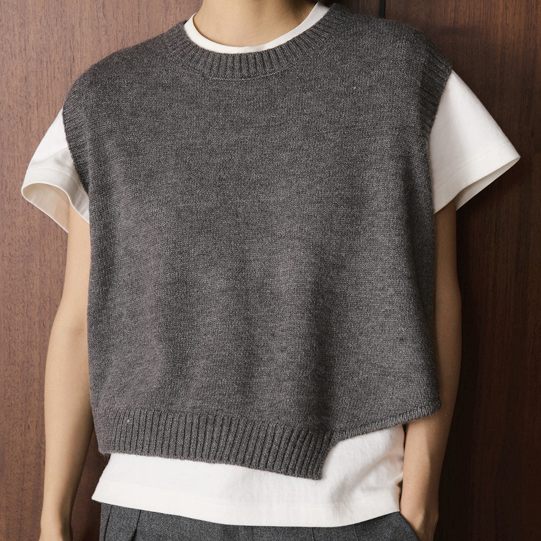 Asymmetric hem solid color round neck knitted vest top