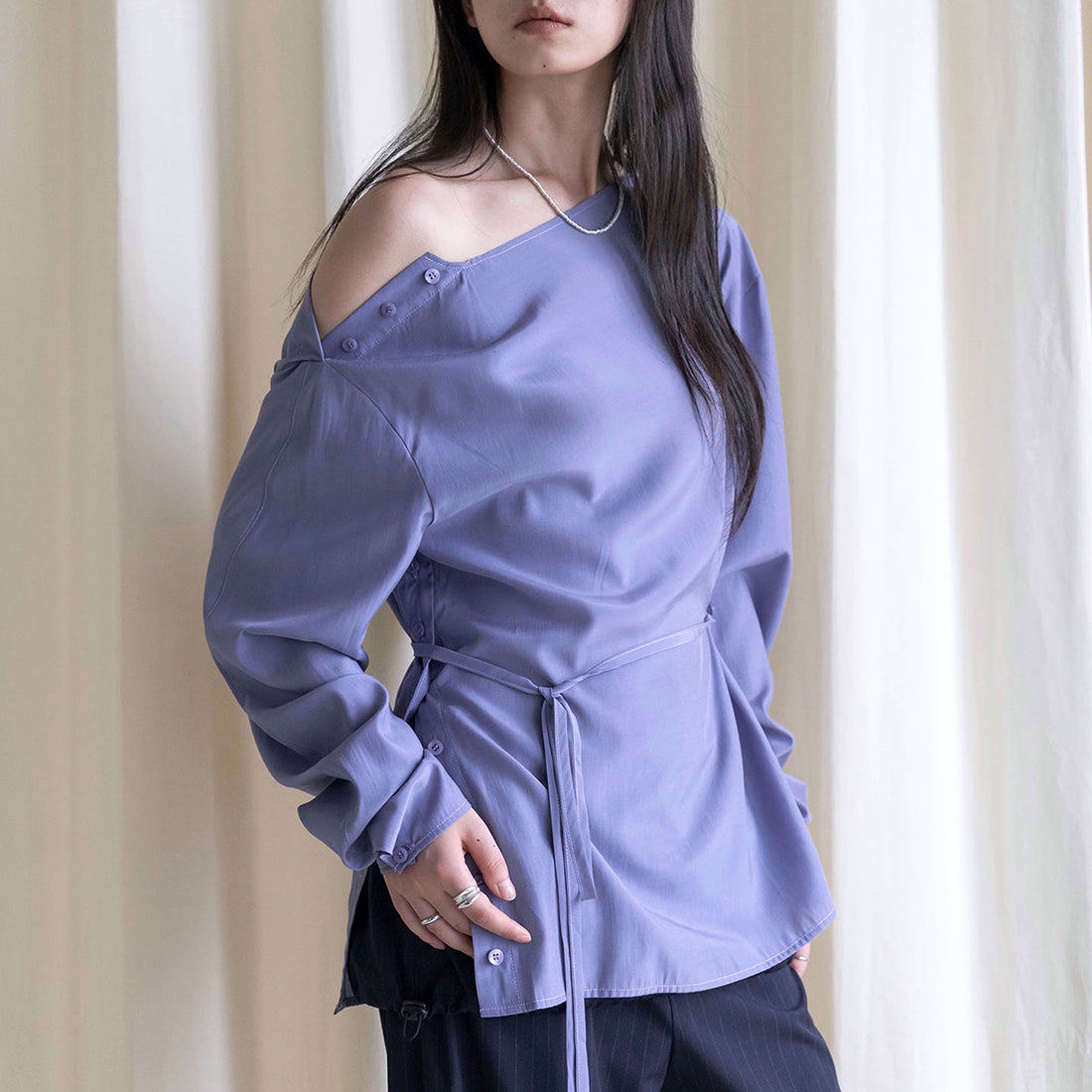 Asymmetric diagonal buckle strap waist cinching shirt top