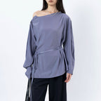 Asymmetric diagonal buckle strap waist cinching shirt top