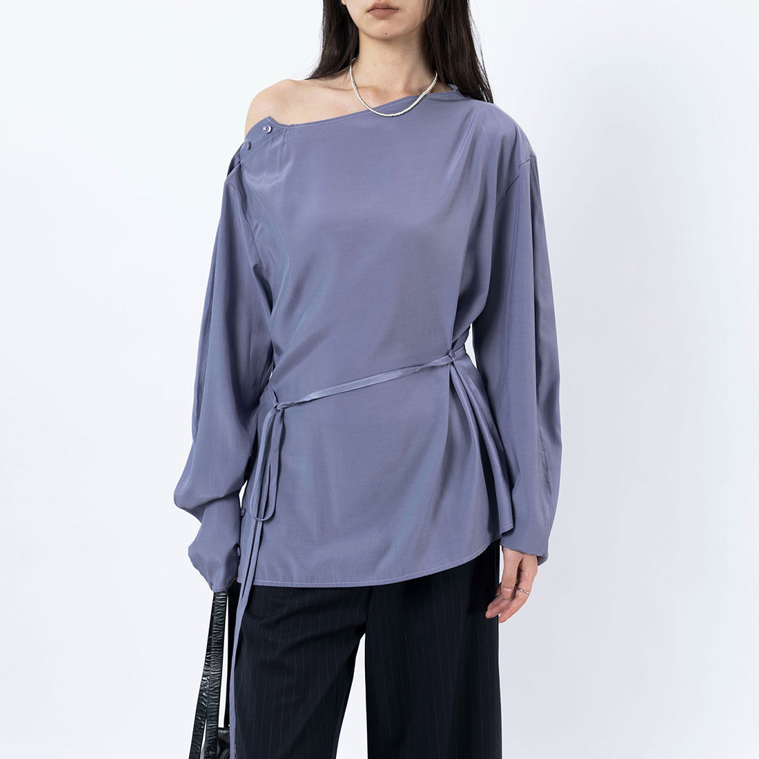 Asymmetric diagonal buckle strap waist cinching shirt top