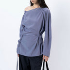 Asymmetric diagonal buckle strap waist cinching shirt top