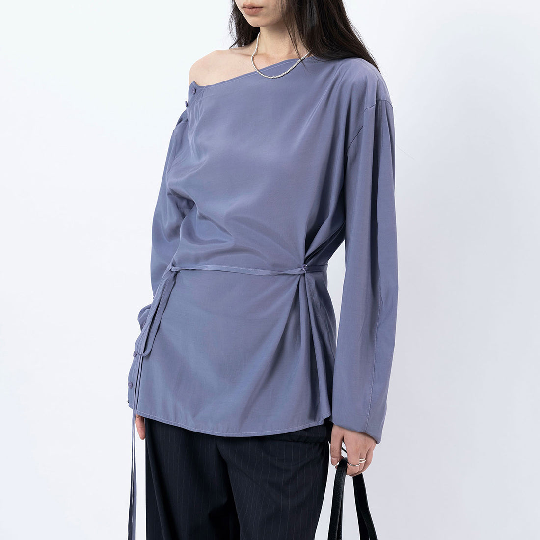 Asymmetric diagonal buckle strap waist cinching shirt top
