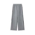 Elastic high waisted side straps and loose wide leg pants